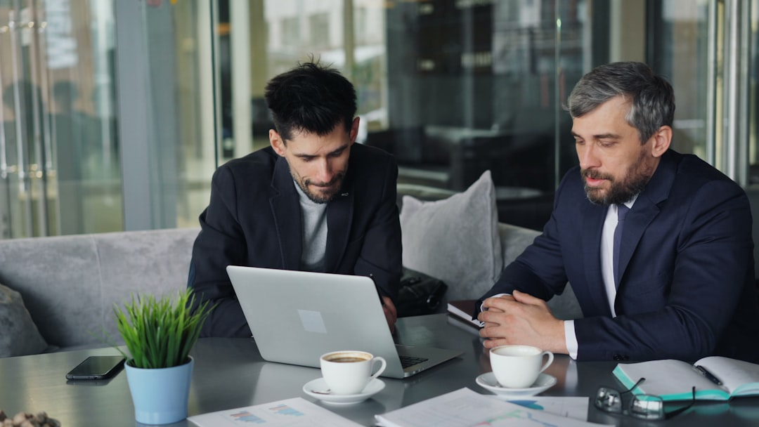 business mentor or consultant meeting with client in office