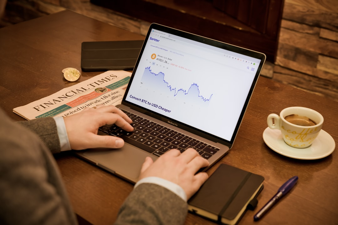 entrepreneur reviewing financial reports on laptop