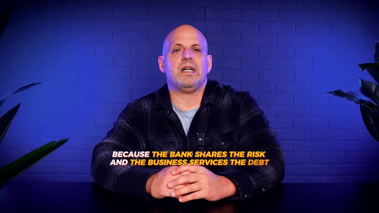 Text overlay: because the bank shares the risk and the business services the debt