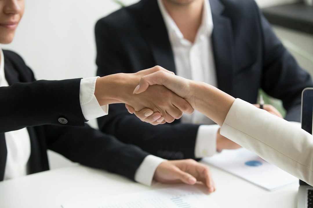 business acquisition planning meeting handshake
