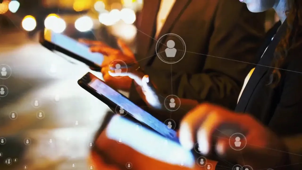 Person using a smartphone with business network icons