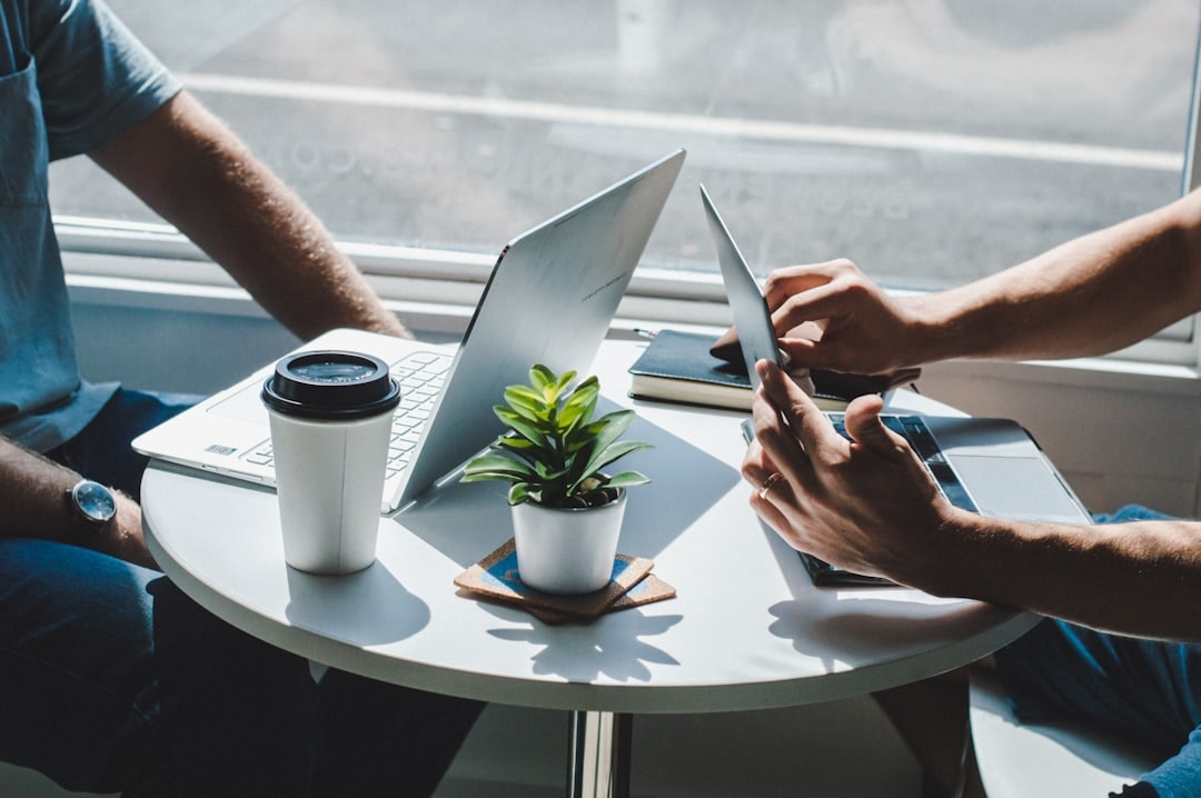 business owner transition corporate to entrepreneur laptop meeting