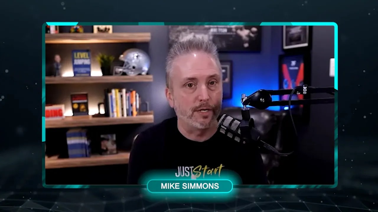 Host in a well-lit studio speaking into a microphone with shelves and soft background lighting.