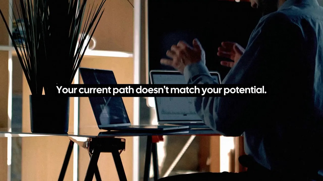 Person in an office setting with text overlay: Your current path doesn't match your potential
