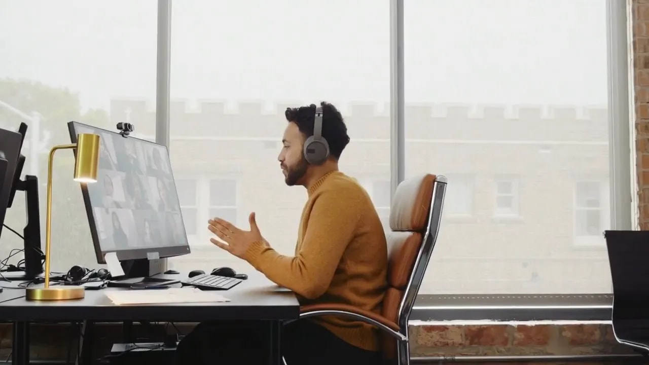 Professional working at a desktop computer in an office