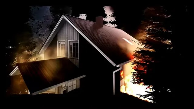 House fire at night with flames and smoke