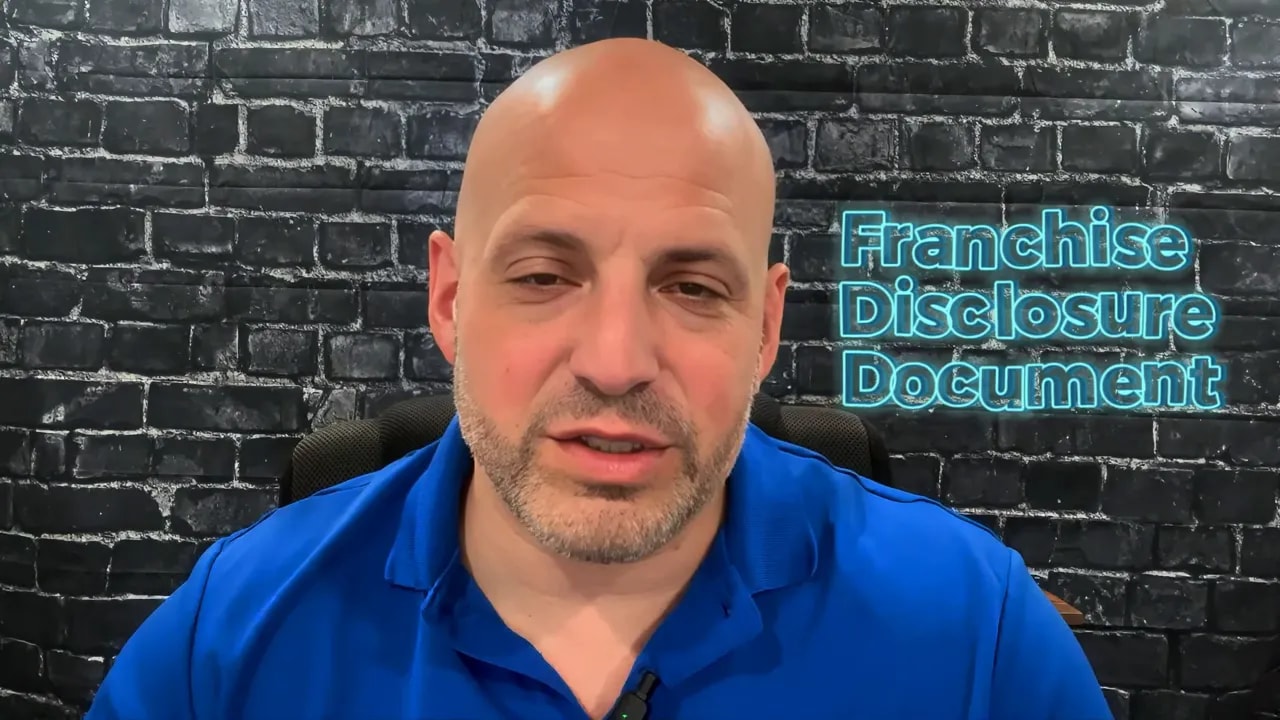 Text reading Franchise Disclosure Document on a brick wall