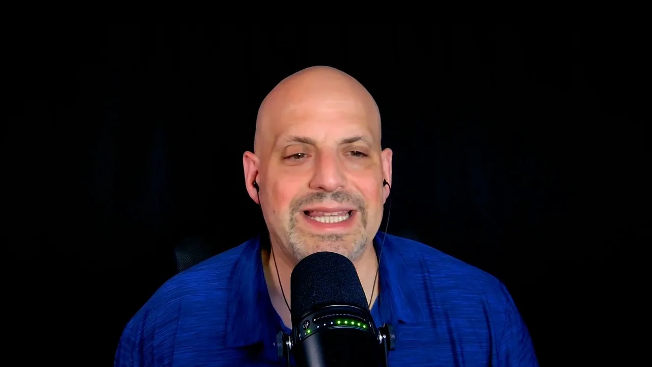 Speaker on business ownership coaching video with microphone