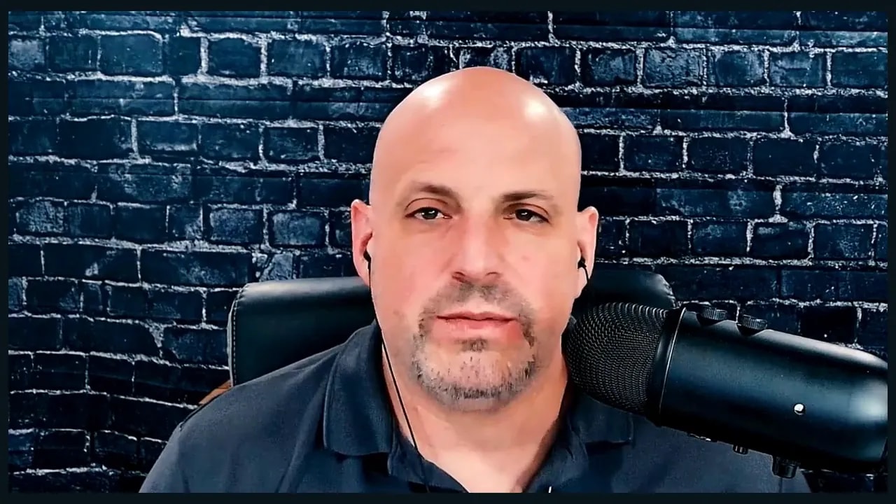 Business ownership coach speaking on video about why franchise ownership is not passive