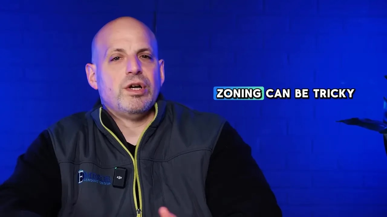 Speaker on blue background with on screen text about zoning being tricky