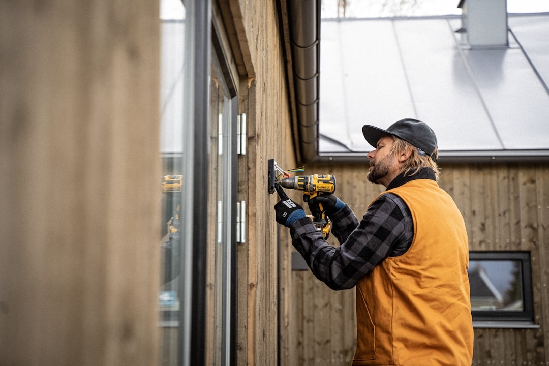 home exterior remodeling contractor working on house