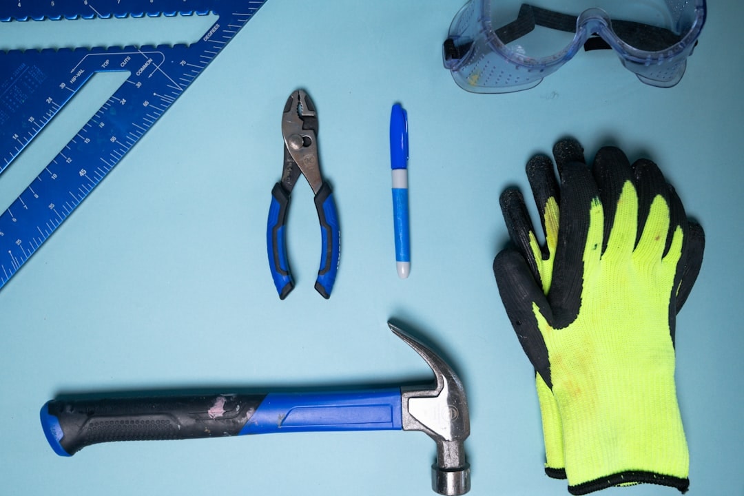 home maintenance technician in uniform with tools