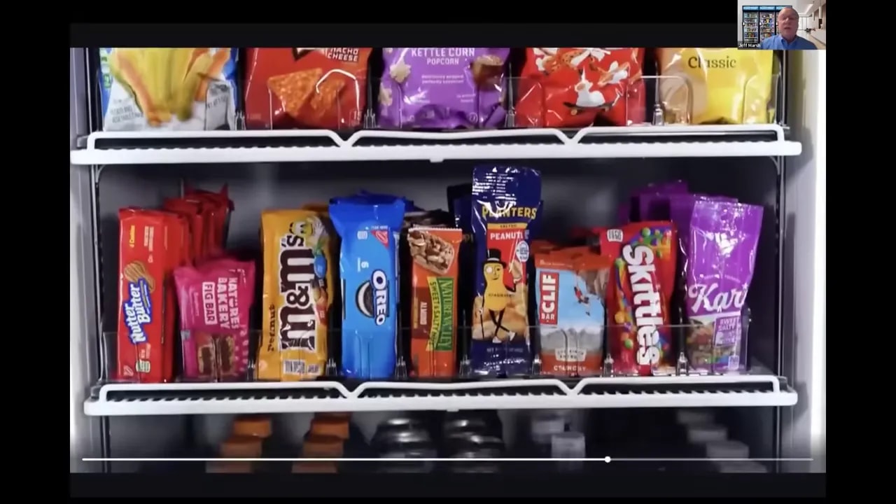Open smart market cooler filled with snacks and beverages