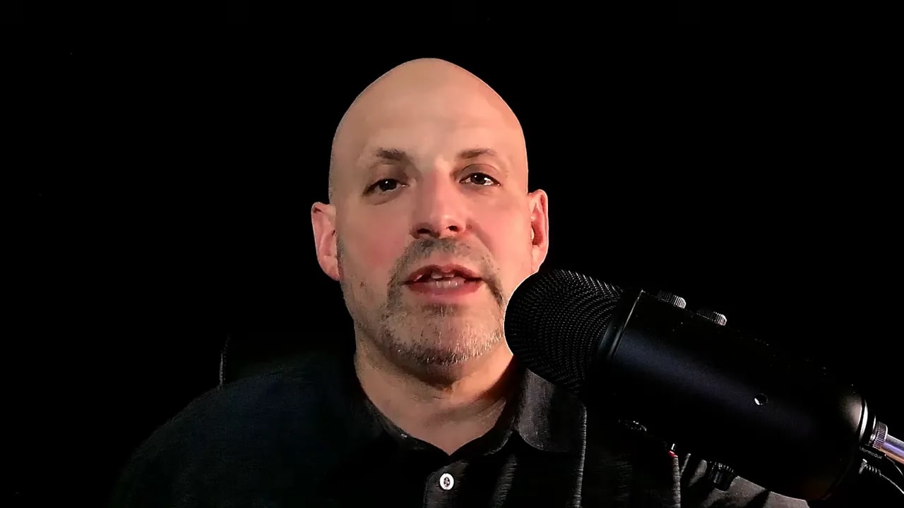 Business Ownership Coach speaking into a microphone on the Investor Financing Podcast
