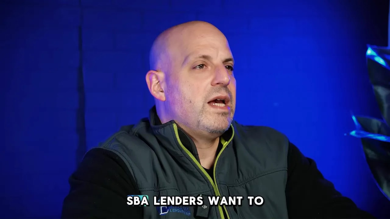 Speaker on blue background with text about SBA lenders wanting to see comps