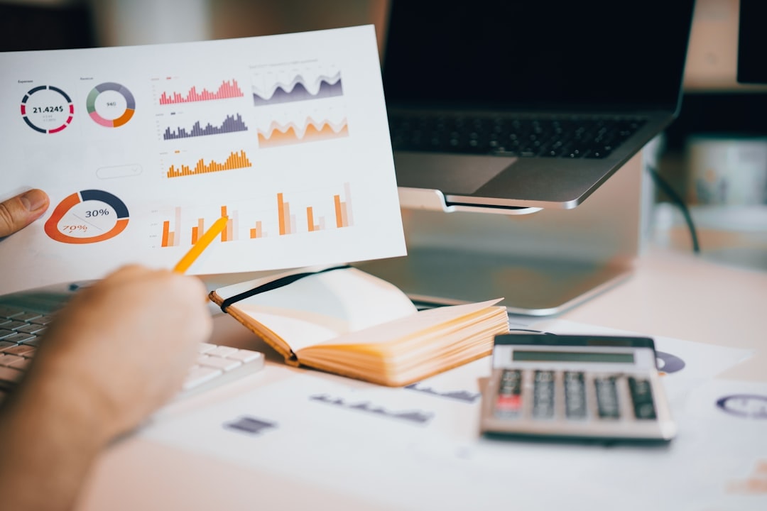 small business owner reviewing financial charts and startup budget
