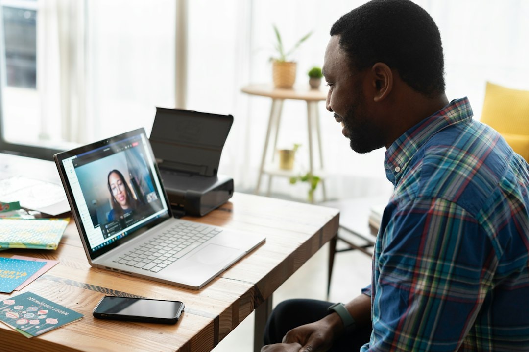 small business owner using laptop video call meeting